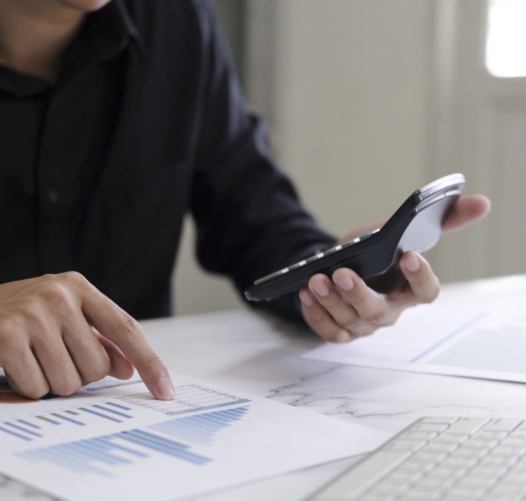business-man-using-calculator-finance-and-accounting-concept-.jpg
