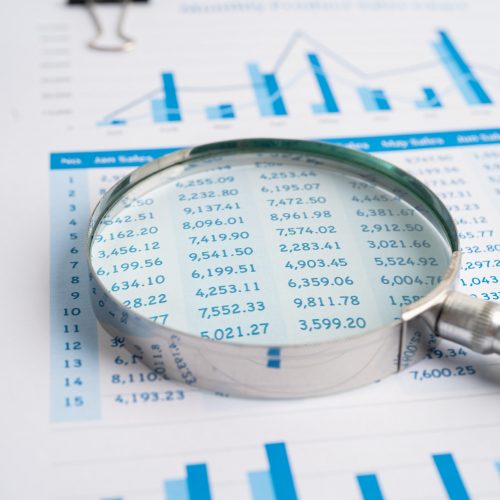 magnifying-glass-on-chart-graph-for-analysis-account-business-trade-.jpg