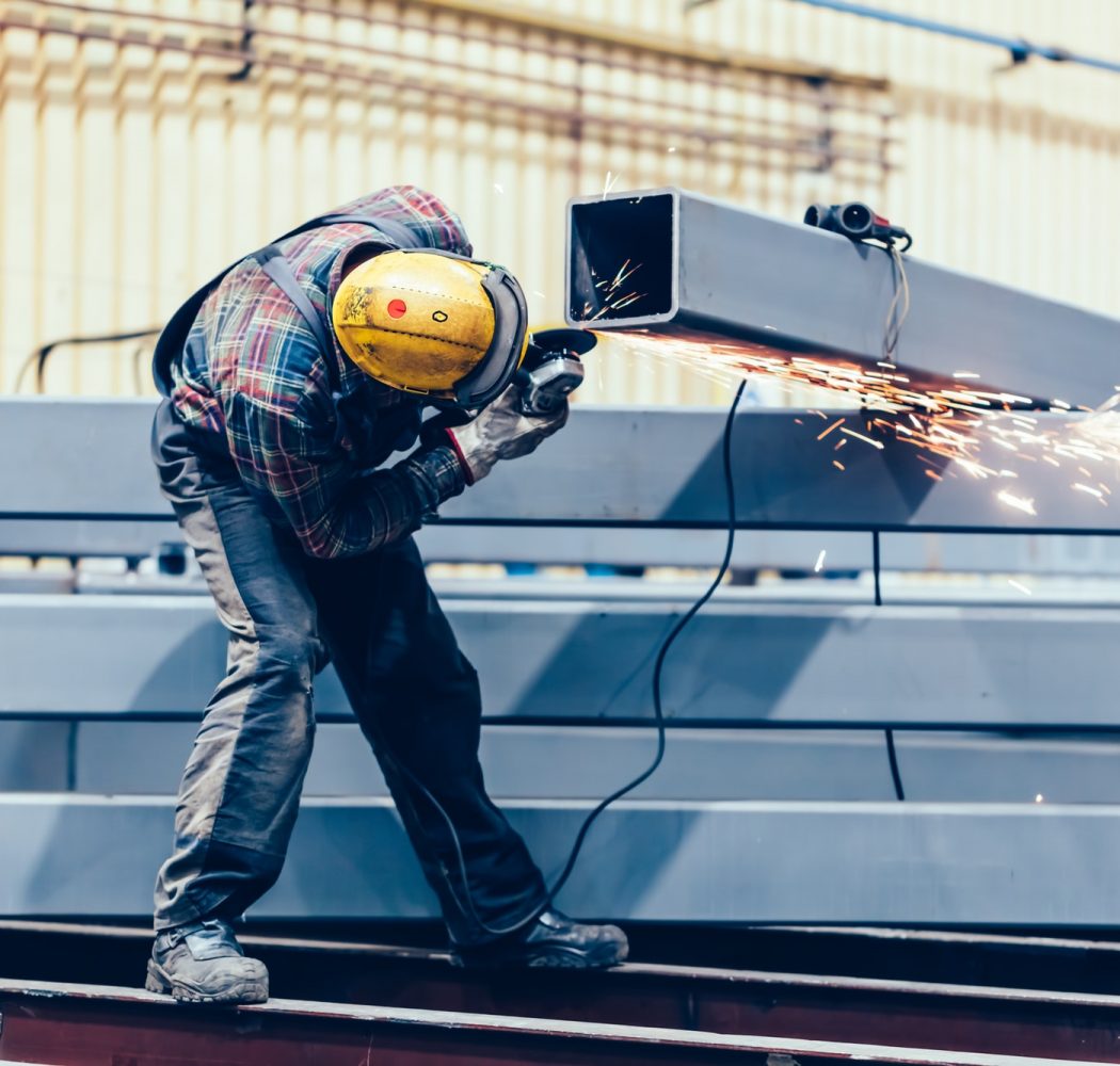 worker-grinding-a-steel-profile-in-factory-.jpg